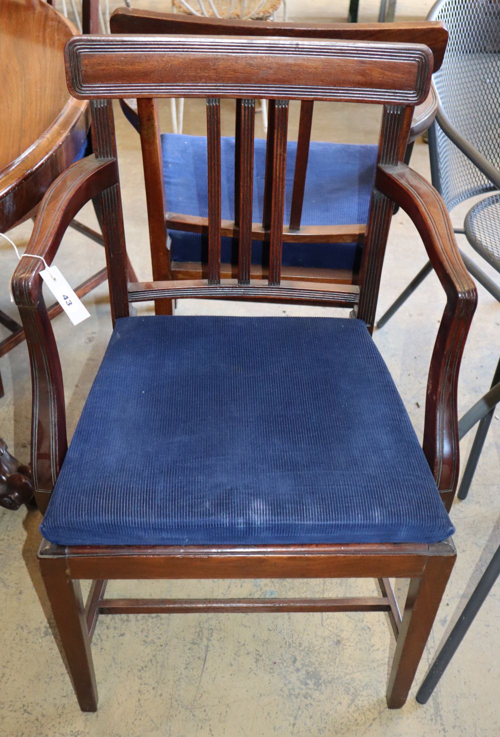 A set of six George III mahogany dining chairs (two with arms)
